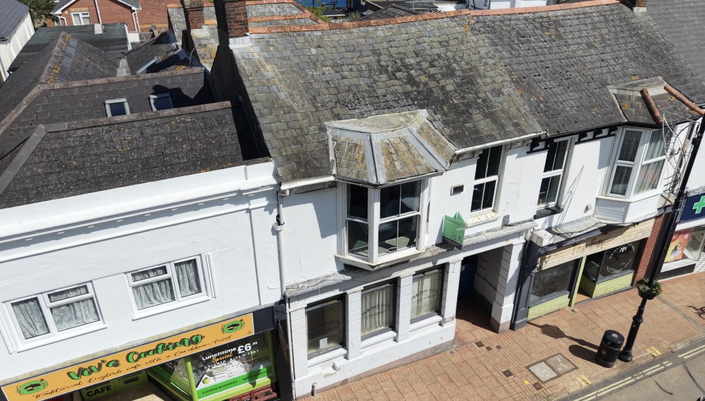 Lot: 75 - FREEHOLD TOWN CENTRE BUILDING WITH POTENTIAL - Drone photo of the building from above